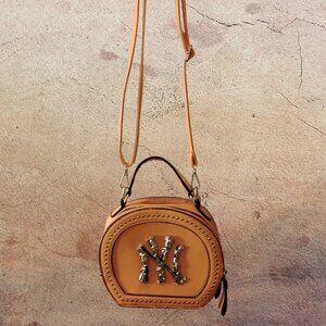 This is a New York Yankees circle crossbody bag